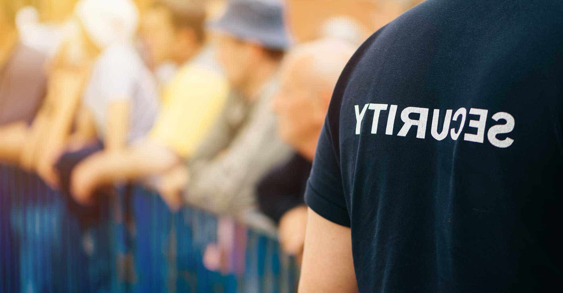 Security guard monitoring a crowd at a public event